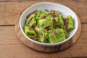 Paccheri with pea cream and speck